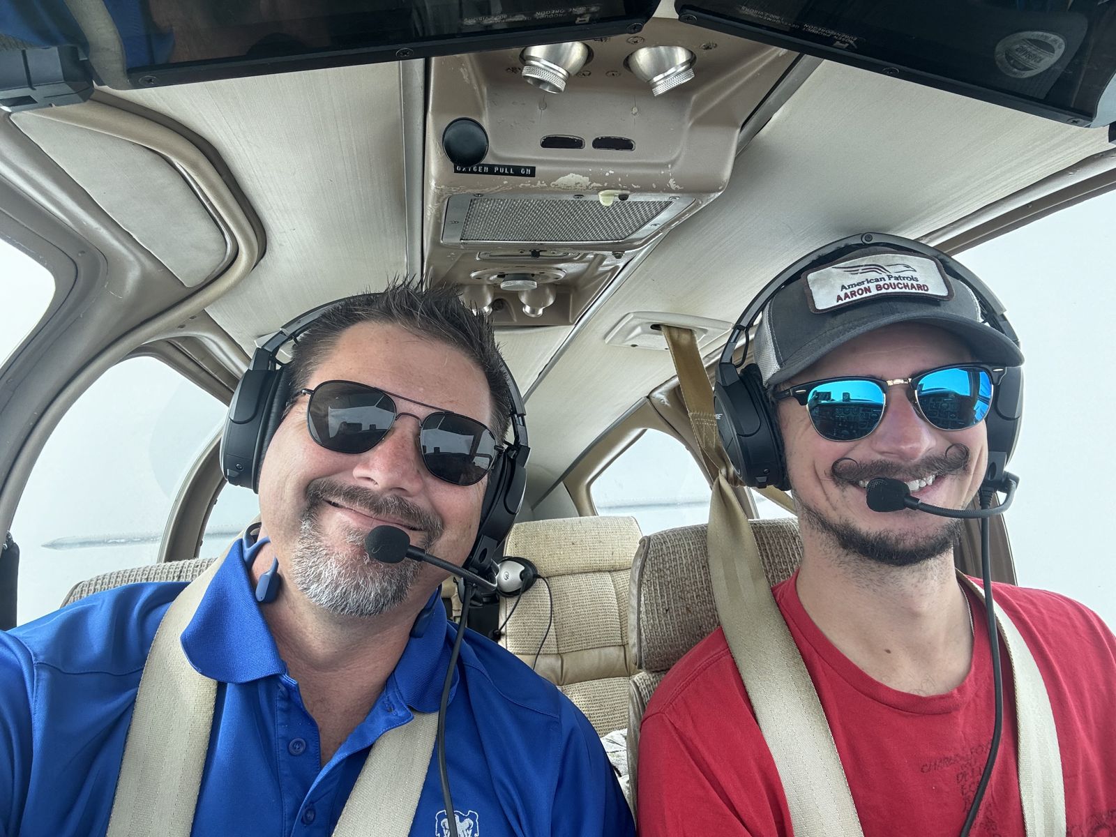 Pilots in headsets in the cockpit