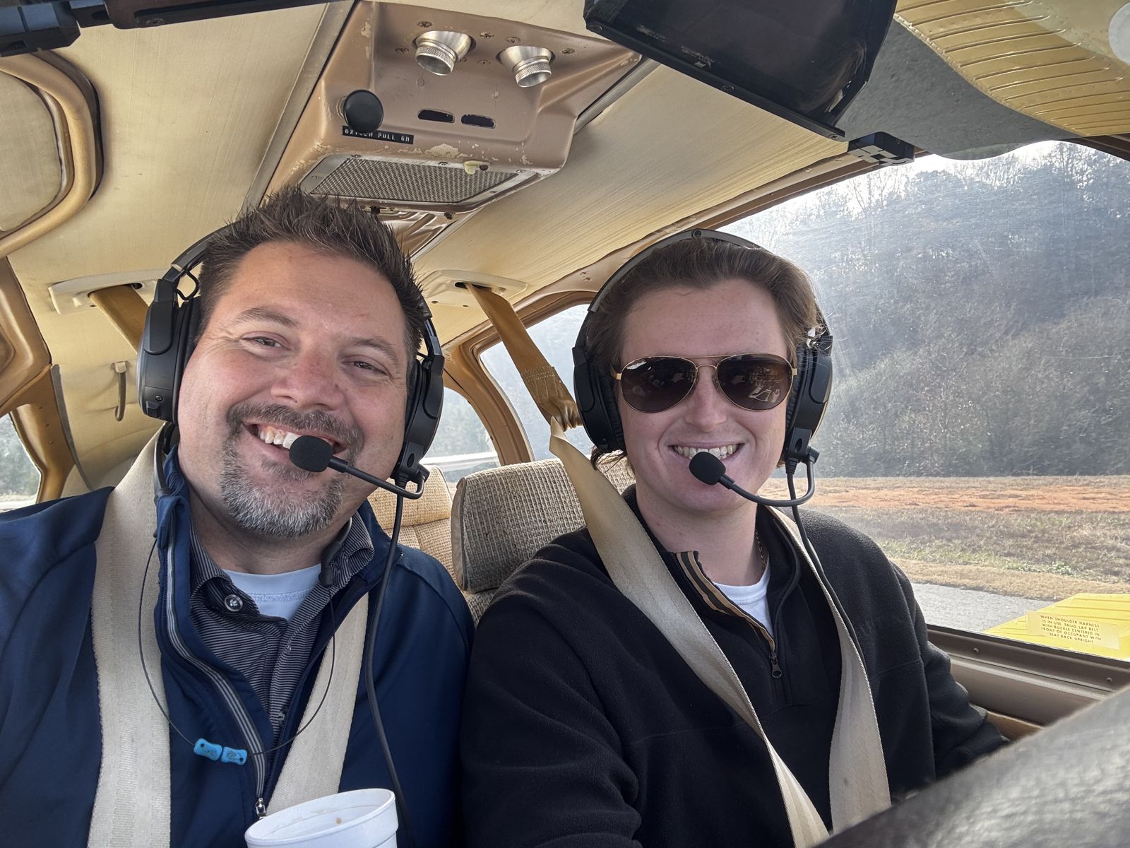 Two pilots ready to fly in the cockpit